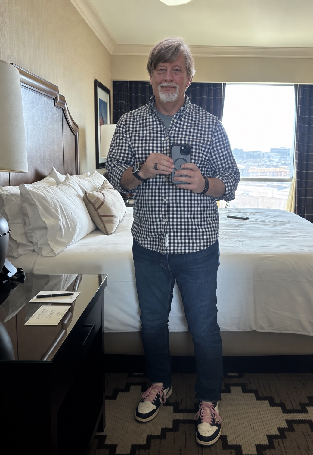 Richard in a checked shirt and jeans